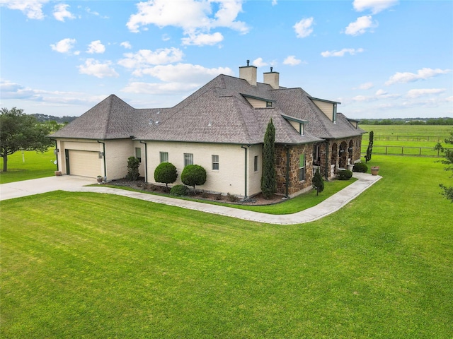2750 Fm 563, Anahuac, TX 77514 - view of side of property featuring concrete driveway, a chimney, a shingled roof, and an attached garage