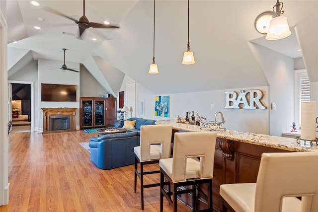 2750 Fm 563, Anahuac, TX 77514 - kitchen with ceiling fan, vaulted ceiling, light wood-style floors, pendant lighting, and recessed lighting