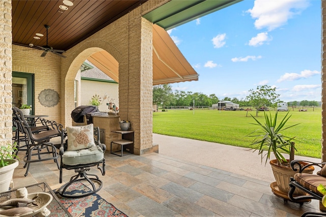 2750 Fm 563, Anahuac, TX 77514 - view of patio featuring a ceiling fan and area for grilling