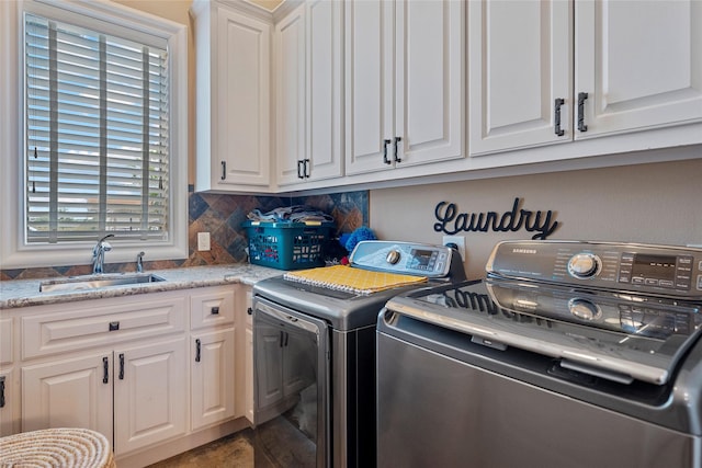 2750 Fm 563, Anahuac, TX 77514 - laundry room featuring cabinet space and washing machine and dryer