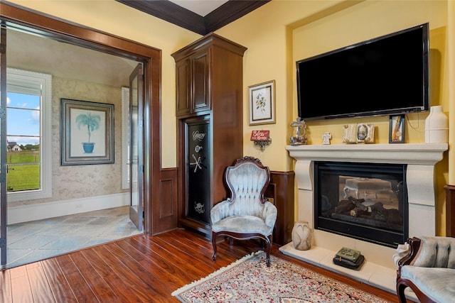 2750 Fm 563, Anahuac, TX 77514 - living area with dark wood-style floors, a multi sided fireplace, crown molding, and wainscoting