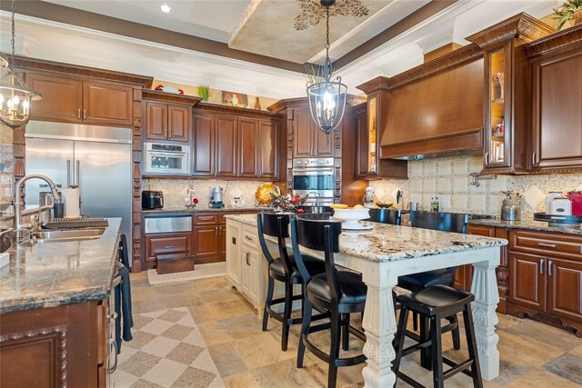 2750 Fm 563, Anahuac, TX 77514 - kitchen with a center island, tasteful backsplash, light stone countertops, glass insert cabinets, and a warming drawer