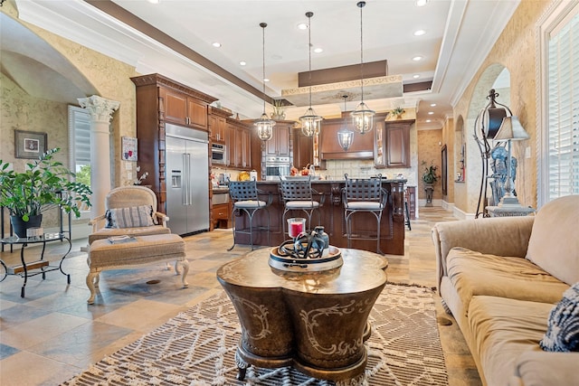 2750 Fm 563, Anahuac, TX 77514 - living room featuring a raised ceiling, crown molding, recessed lighting, and ornate columns