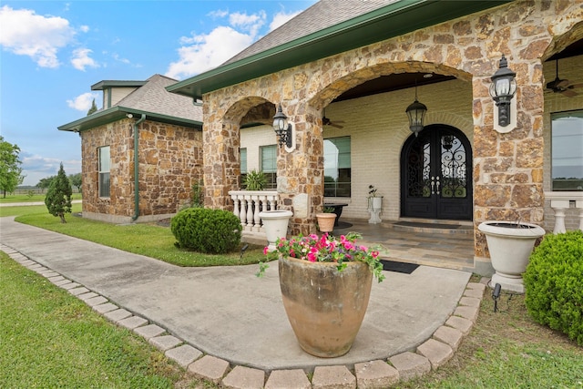 2750 Fm 563, Anahuac, TX 77514 - entrance to property with a shingled roof, stone siding, and brick siding