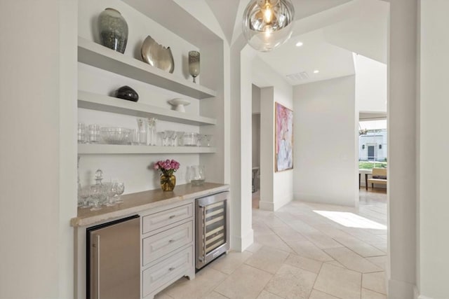 7526 Janak Dr, Houston, TX 77055 - indoor dry bar with wine cooler, built in shelves, refrigerator, light tile patterned floors, and recessed lighting
