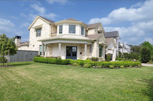 7526 Janak Dr, Houston, TX 77055 - view of front facade featuring stone siding, stucco siding, a standing seam roof, a metal roof, and roof with shingles
