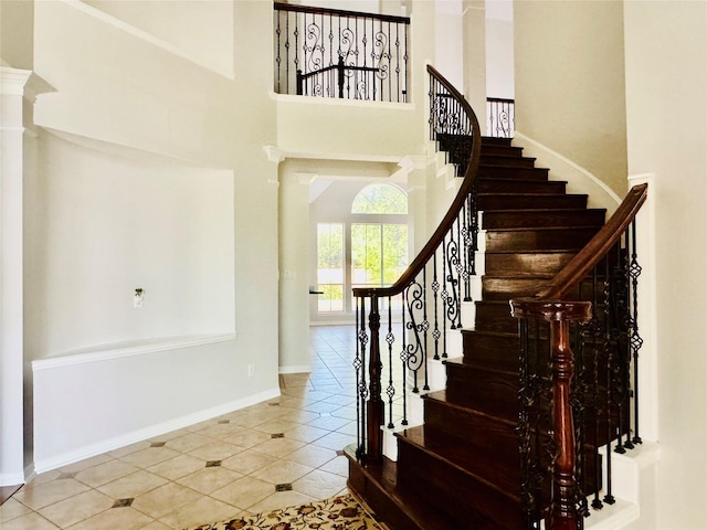 5403 Emerald Pointe Ln, Sugar Land, TX 77479 - tiled entryway featuring stairs and a towering ceiling