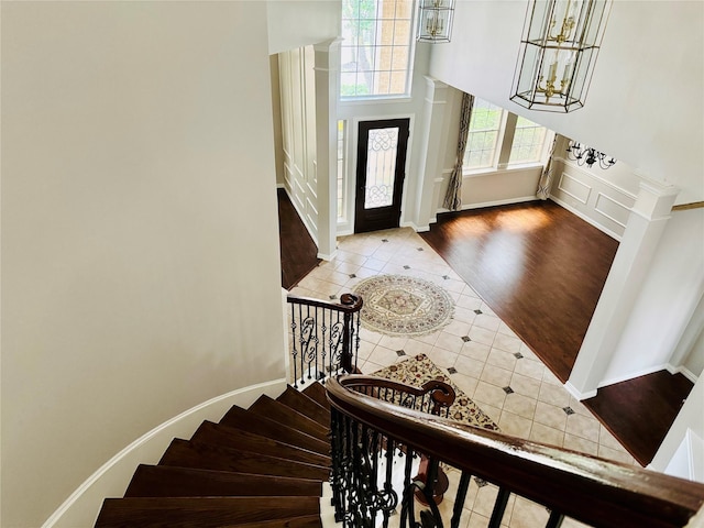 5403 Emerald Pointe Ln, Sugar Land, TX 77479 - entrance foyer with tile patterned floors, stairway, a towering ceiling, and a chandelier
