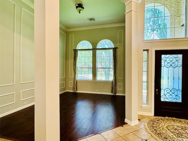 5403 Emerald Pointe Ln, Sugar Land, TX 77479 - foyer entrance featuring decorative columns, ornamental molding, and hardwood / wood-style floors