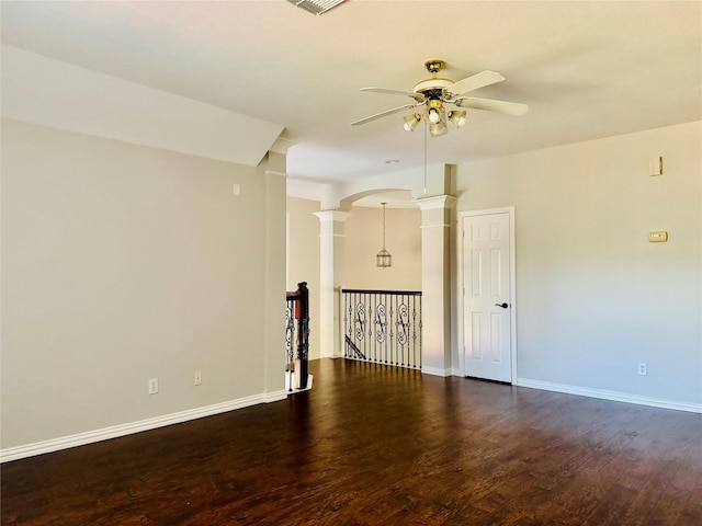 5403 Emerald Pointe Ln, Sugar Land, TX 77479 - unfurnished room featuring decorative columns, a ceiling fan, arched walkways, and wood finished floors