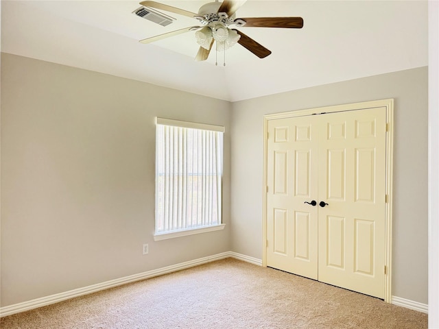 5403 Emerald Pointe Ln, Sugar Land, TX 77479 - unfurnished bedroom with light carpet, a closet, a ceiling fan, and vaulted ceiling