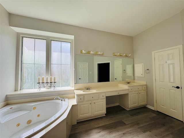 5403 Emerald Pointe Ln, Sugar Land, TX 77479 - full bath featuring plenty of natural light, a tub with jets, double vanity, and wood finished floors