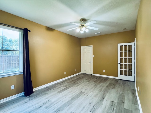 5403 Emerald Pointe Ln, Sugar Land, TX 77479 - spare room with plenty of natural light, wood finished floors, and a ceiling fan