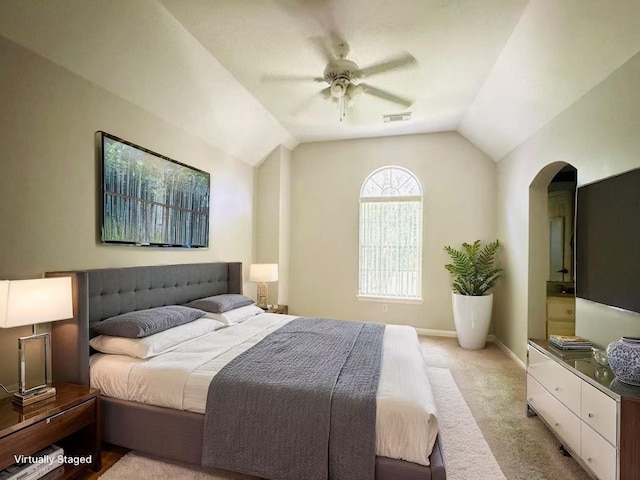 5403 Emerald Pointe Ln, Sugar Land, TX 77479 - bedroom featuring vaulted ceiling, light carpet, arched walkways, and a ceiling fan