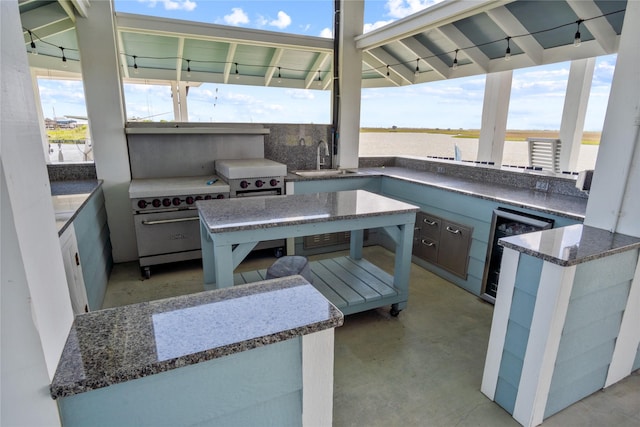 1301 Lagoon Dr, Crystal Beach, TX 77650 - view of patio / terrace featuring beverage cooler and area for grilling