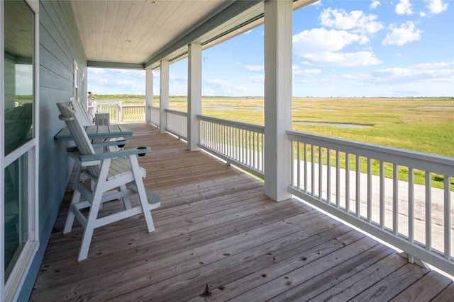1301 Lagoon Dr, Crystal Beach, TX 77650 - wooden porch featuring a view of countryside