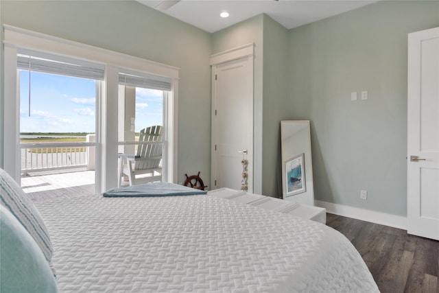 1301 Lagoon Dr, Crystal Beach, TX 77650 - bedroom with dark wood-style flooring, access to exterior, and recessed lighting