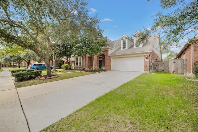23702 Whispering Wind, Katy, TX 77494 - view of front facade with brick siding, driveway, a garage, and a shingled roof