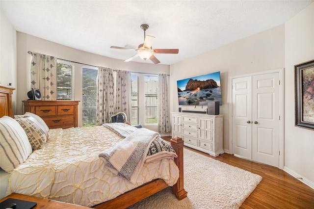 23702 Whispering Wind, Katy, TX 77494 - bedroom with wood finished floors, ceiling fan, and a closet