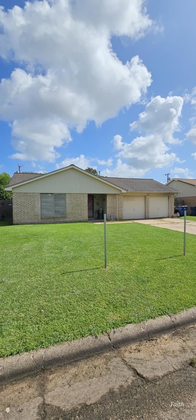 2714 6th Ave N, Texas City, TX 77590 - view of front of house featuring brick siding, concrete driveway, and an attached garage