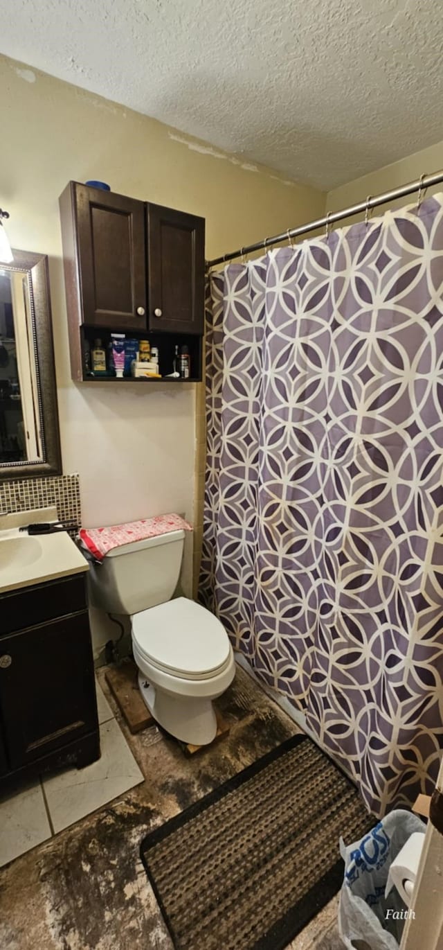 2714 6th Ave N, Texas City, TX 77590 - full bathroom featuring vanity, a textured ceiling, and a shower with curtain