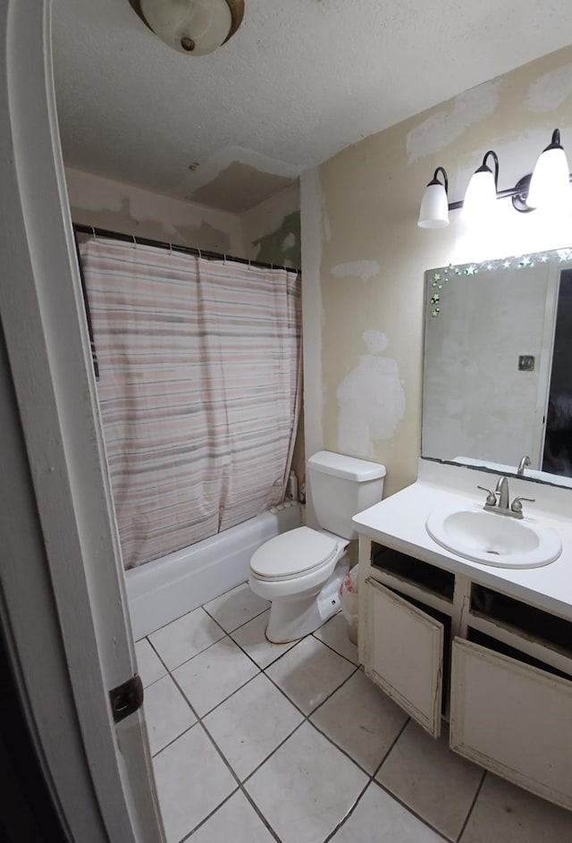 2714 6th Ave N, Texas City, TX 77590 - bathroom with vanity, shower / bath combo, tile patterned floors, and a textured ceiling