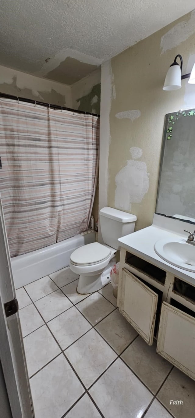 2714 6th Ave N, Texas City, TX 77590 - bathroom with vanity, a textured ceiling, shower / bath combo, and tile patterned flooring
