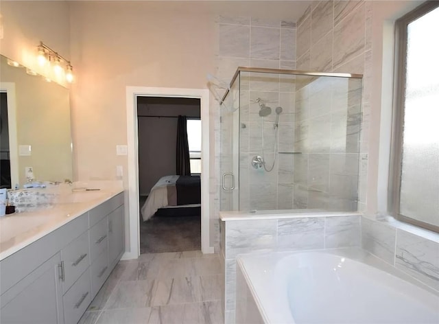 917 Crystal Bend Ln, Katy, TX 77493 - full bathroom with connected bathroom, a garden tub, a stall shower, double vanity, and marble look tile flooring