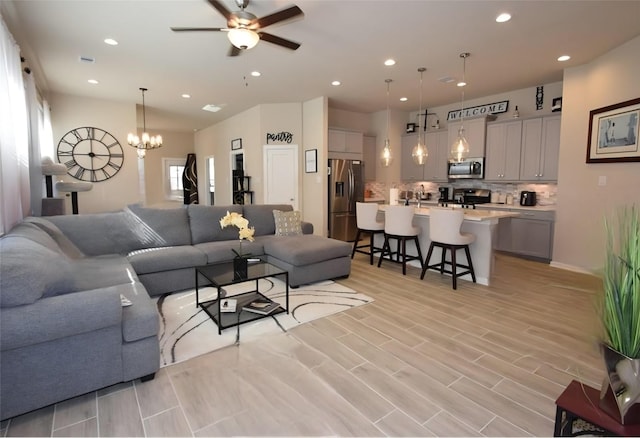 917 Crystal Bend Ln, Katy, TX 77493 - living area featuring recessed lighting, a ceiling fan, a chandelier, and light wood-type flooring
