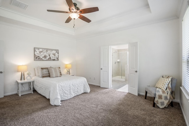 16070 Deer Pines Dr, Conroe, TX 77303 - carpeted bedroom with a raised ceiling, crown molding, connected bathroom, and ceiling fan