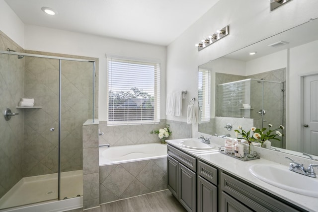 16070 Deer Pines Dr, Conroe, TX 77303 - bathroom featuring a shower stall, a garden tub, and double vanity