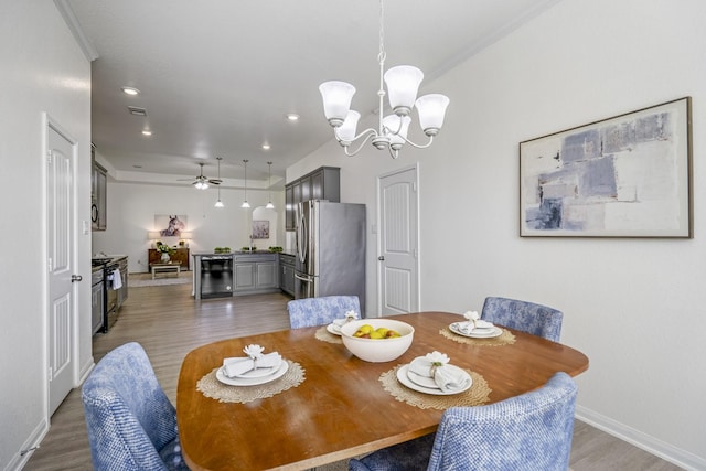 16070 Deer Pines Dr, Conroe, TX 77303 - dining room with light wood-style floors, a chandelier, ceiling fan, beverage cooler, and recessed lighting