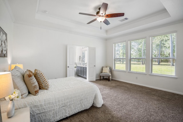16070 Deer Pines Dr, Conroe, TX 77303 - carpeted bedroom with a raised ceiling, crown molding, a ceiling fan, and ensuite bathroom
