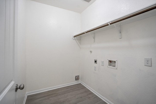 16070 Deer Pines Dr, Conroe, TX 77303 - laundry area with hookup for an electric dryer, wood finished floors, hookup for a washing machine, and hookup for a gas dryer