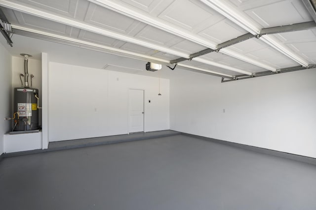 16070 Deer Pines Dr, Conroe, TX 77303 - garage with water heater and a garage door opener