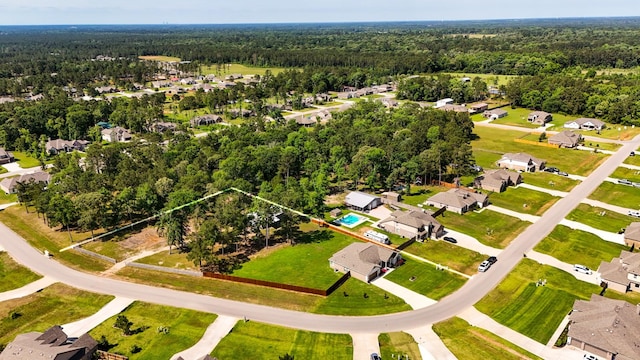 16070 Deer Pines Dr, Conroe, TX 77303 - aerial perspective of suburban area with a heavily wooded area and property parcel outlined