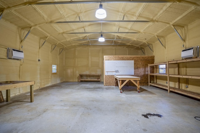 16070 Deer Pines Dr, Conroe, TX 77303 - garage with an AC wall unit and a workshop area