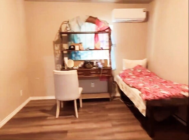 1811 S Brazos St, San Antonio, TX 78207 - bedroom featuring wood finished floors and a wall unit AC