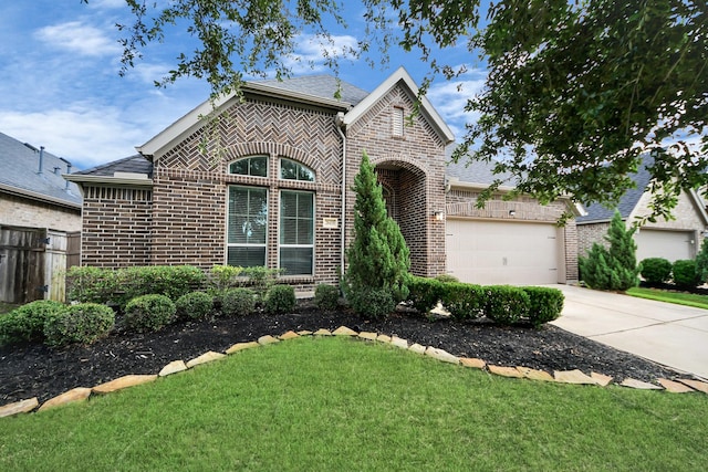 28430 Sycamore Falls Ln, Fulshear, TX 77441 - view of front of property featuring brick siding, concrete driveway, and an attached garage