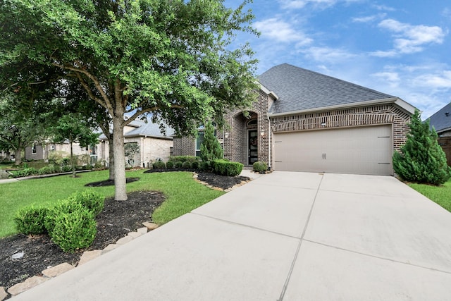 28430 Sycamore Falls Ln, Fulshear, TX 77441 - view of front of home featuring brick siding, roof with shingles, a garage, concrete driveway, and a front lawn