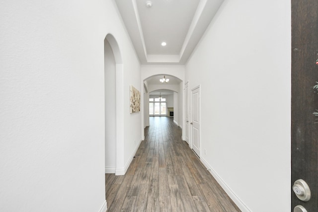 28430 Sycamore Falls Ln, Fulshear, TX 77441 - hallway featuring arched walkways, wood finished floors, and recessed lighting