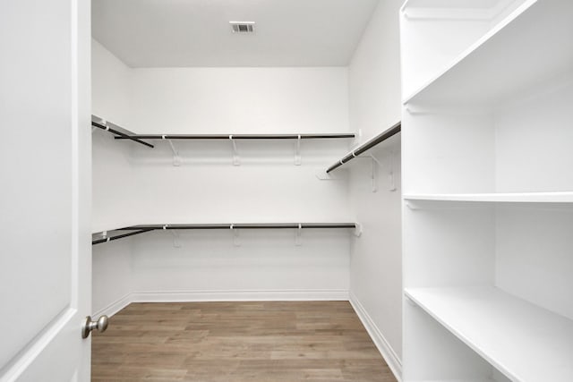 28430 Sycamore Falls Ln, Fulshear, TX 77441 - spacious closet featuring wood finished floors