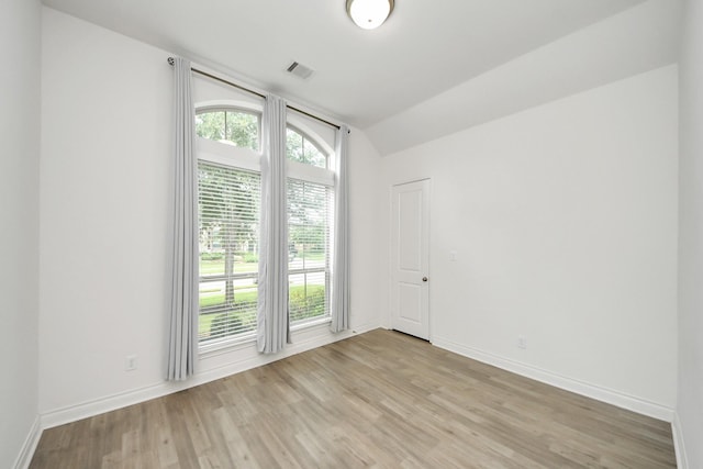 28430 Sycamore Falls Ln, Fulshear, TX 77441 - empty room featuring light wood finished floors and vaulted ceiling