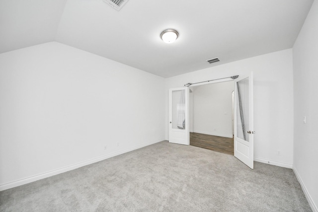 28430 Sycamore Falls Ln, Fulshear, TX 77441 - unfurnished bedroom with carpet, french doors, and lofted ceiling