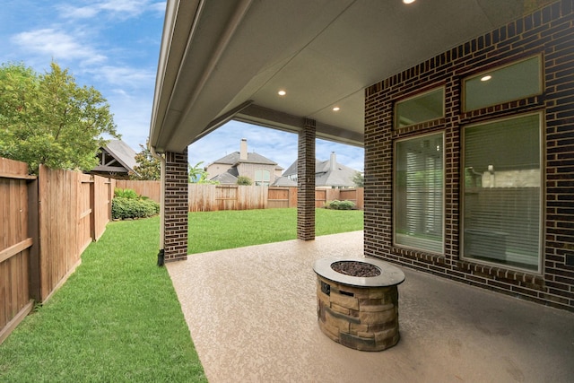 28430 Sycamore Falls Ln, Fulshear, TX 77441 - fenced backyard with a patio area and a fire pit