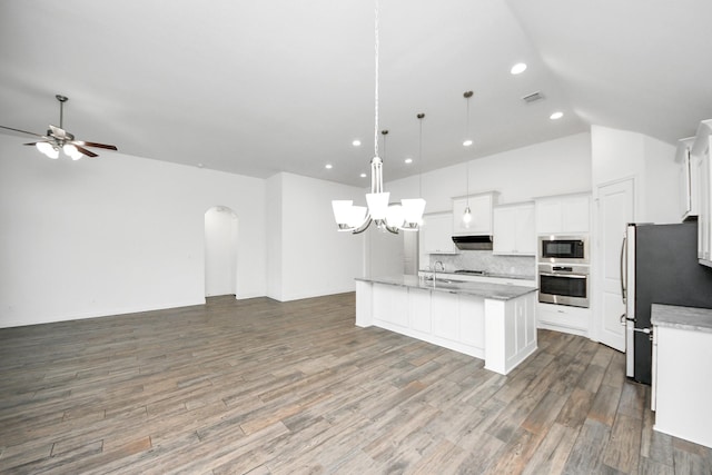28430 Sycamore Falls Ln, Fulshear, TX 77441 - kitchen with stainless steel appliances, open floor plan, a center island with sink, backsplash, and recessed lighting