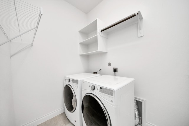 28430 Sycamore Falls Ln, Fulshear, TX 77441 - laundry area with independent washer and dryer and baseboards