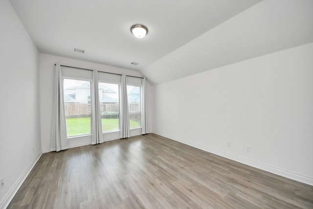 28430 Sycamore Falls Ln, Fulshear, TX 77441 - unfurnished room featuring lofted ceiling and wood finished floors