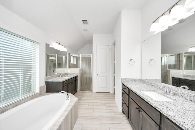 28430 Sycamore Falls Ln, Fulshear, TX 77441 - full bathroom with a shower stall, two vanities, a garden tub, and lofted ceiling