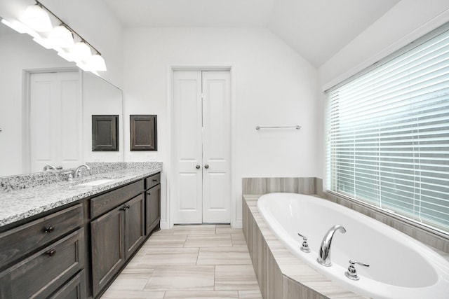 28430 Sycamore Falls Ln, Fulshear, TX 77441 - full bath with vanity, a garden tub, and lofted ceiling